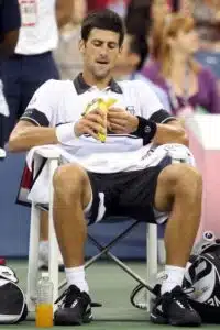 Tennis Playing Eating Banana